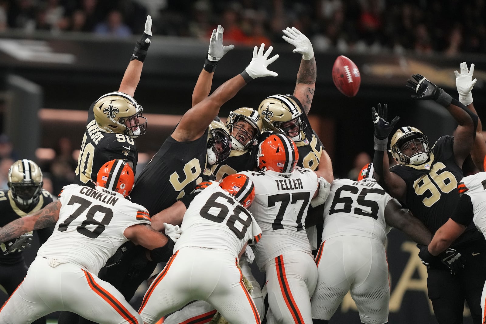 A number of New Orleans Saints defenders attempt to block a field goal by the Cleveland Browns in the first half of an NFL football game in New Orleans, Sunday, Nov. 17, 2024. The field goal was no good. (AP Photo/Gerald Herbert)