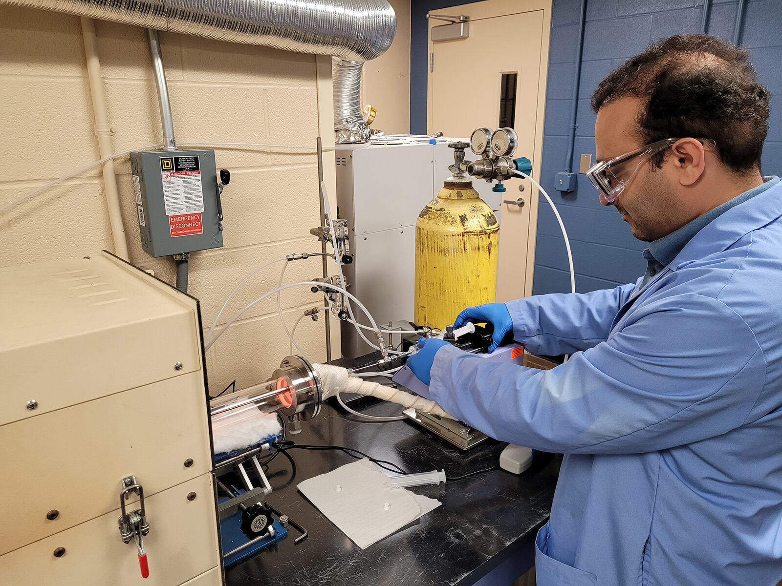 A researcher works on treating PFAS at University of Dayton's Research Institute.