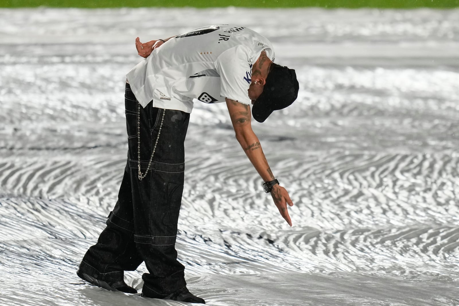 Brazilian soccer player Neymar greets fans during his presentation ceremony after signing a six-month contract with Santos FC at Vila Belmiro Stadium in Santos, Brazil, Friday, Jan. 31, 2025. (AP Photo/Andre Penner)