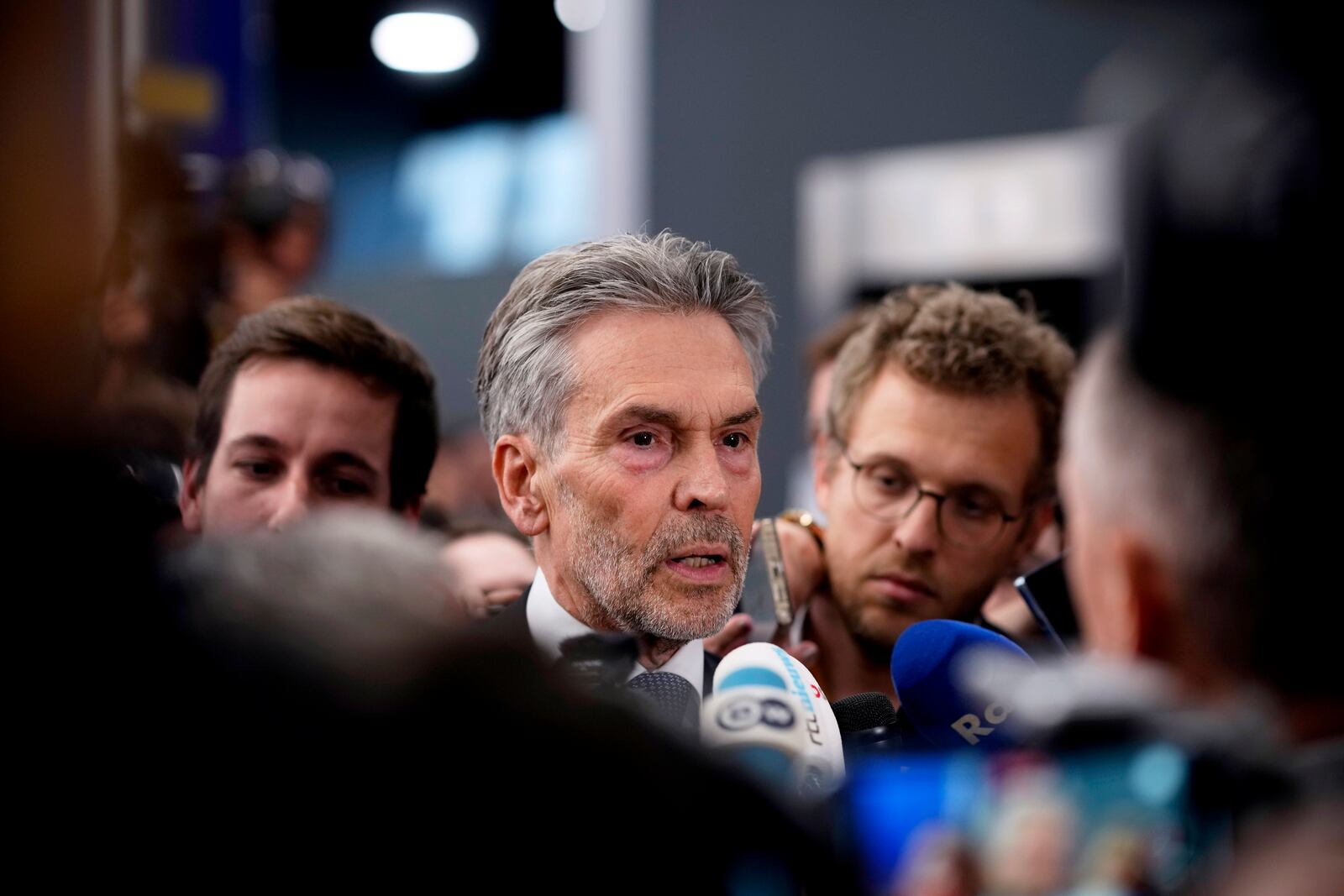 Netherland's Prime Minister Dick Schoof, center, speaks with journalists during an EU Summit at the Puskas Arena in Budapest, Hungary, Friday, Nov. 8, 2024. (AP Photo/Petr David Josek)