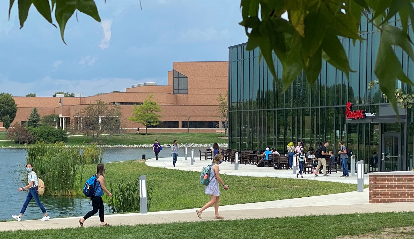 Several Cedarville University students walk past the new Chick-fil-A dining facility on campus on their way to their classes. Photo by Mark D. Weinstein