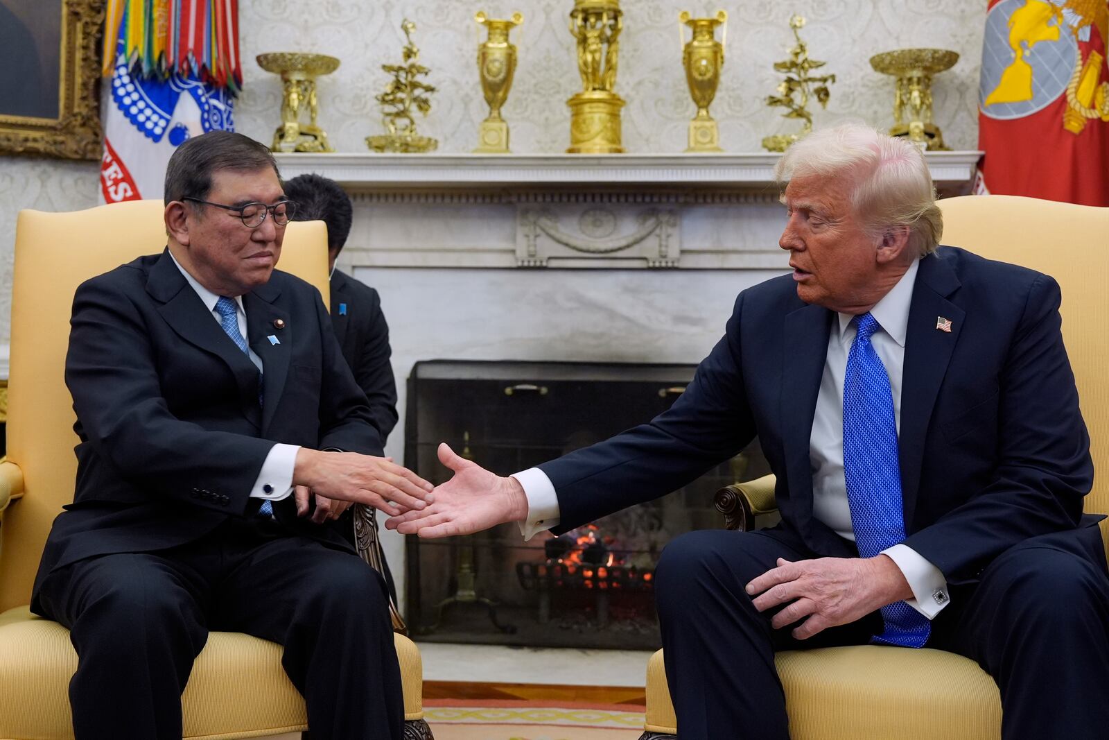 President Donald Trump greets Japanese Prime Minister Shigeru Ishiba in the Oval Office of the White House, Friday, Feb. 7, 2025, in Washington. (AP Photo/Alex Brandon)