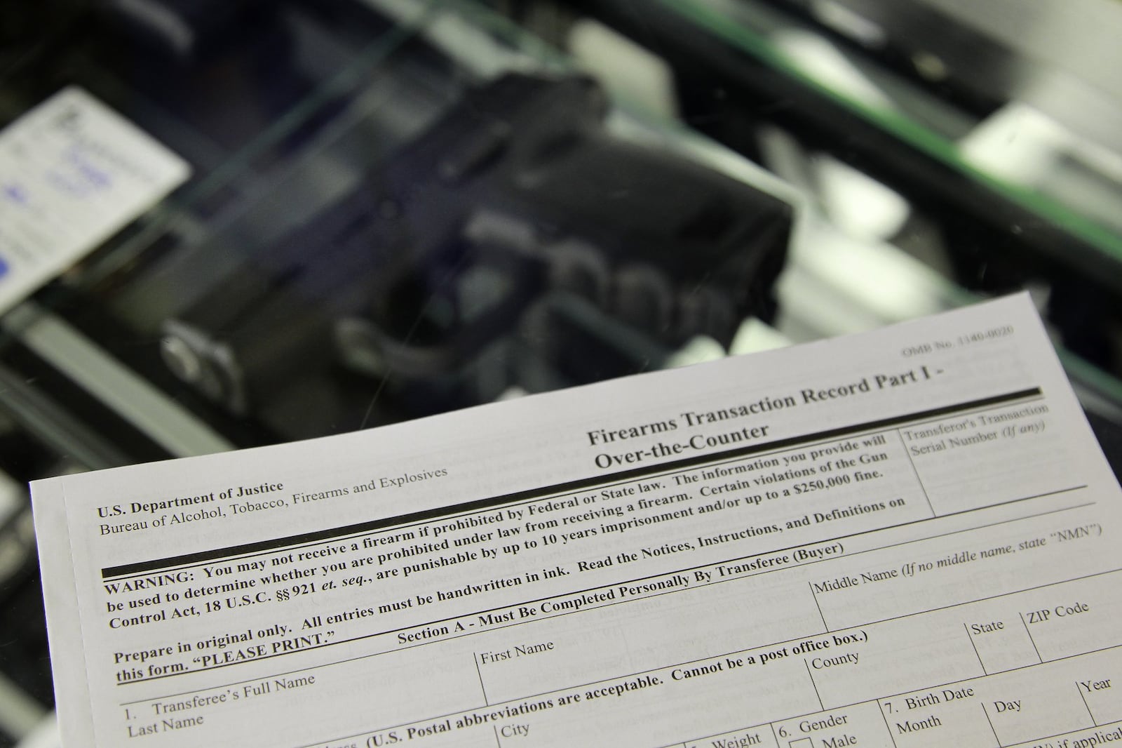 Gun buyers are required to complete a federal background check form when purchasing a gun from a licensed firearms dealer, who then sends the buyer’s name to an FBI database to determine if anything prohibits the person from purchasing the firearm. CHRIS STEWART / STAFF