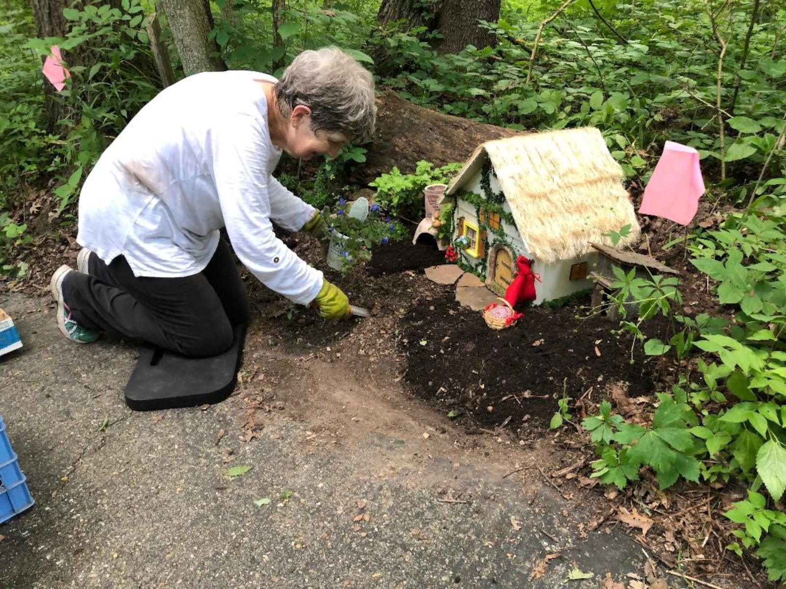 Janie Gehman installs her fairy house. CONTRIBUTED/DAVID ANDERSON