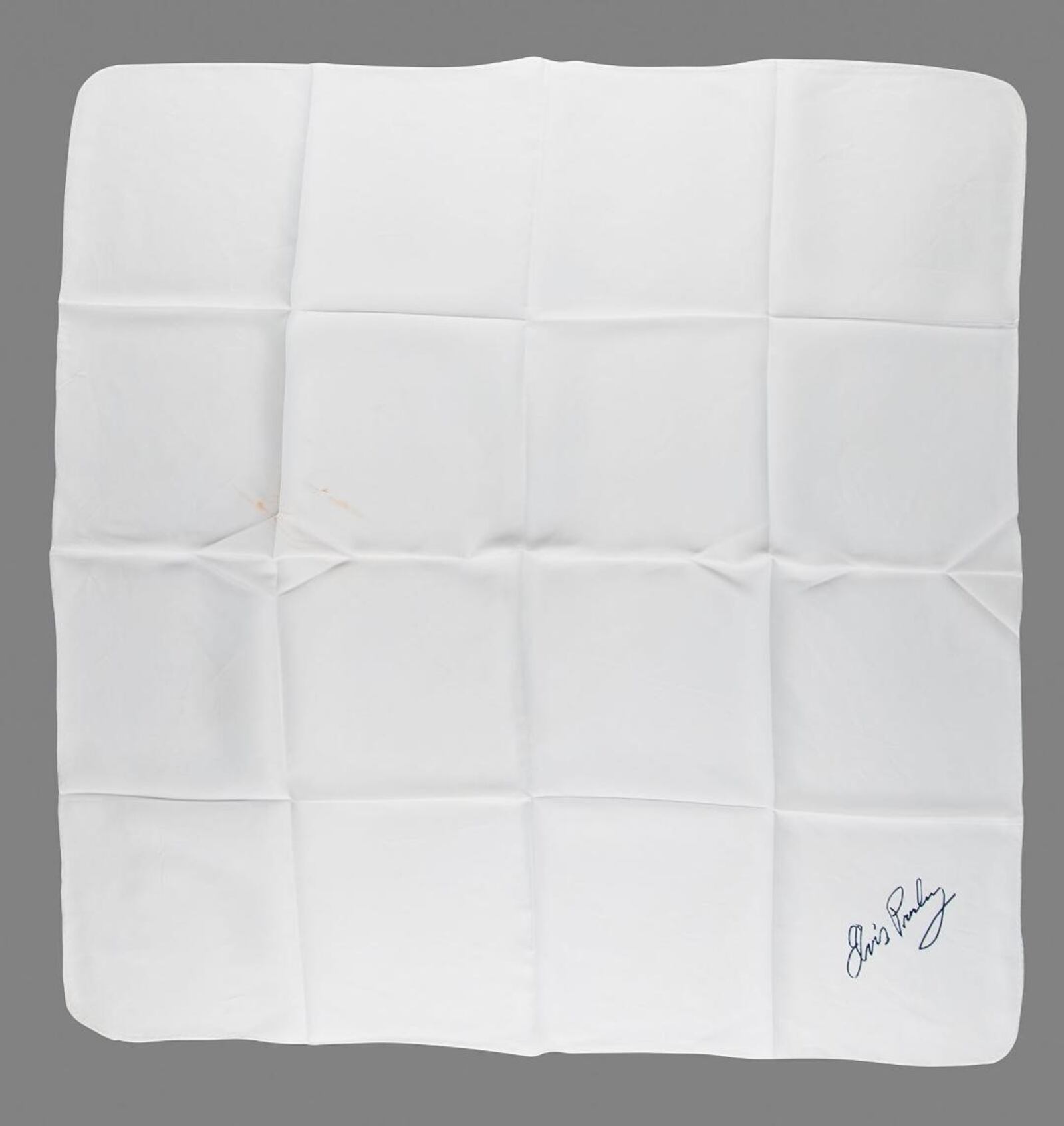 A vintage white silk scarf attested to as being worn by Elvis Presley during his 1974 concert at the University of Dayton Arena is set to be auctioned by Boston-based RR Auction. CONTRIBUTED