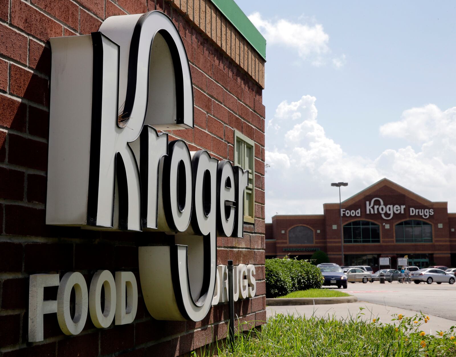 FILE - This June 17, 2014, file photo, shows a Kroger store in Houston. Billionaire Warren Buffett's company has again increased the size of its bet on grocery giant Kroger, while scaling back several of its health care industry investments. Berkshire Hathaway Inc. said in a quarterly update with regulators Monday, Aug. 16, 2021, that it picked up nearly 11 million shares of Kroger stock during the second quarter, raising its holdings to 61.8 million shares. Buffett's company has been steadily adding to its Kroger holdings in recent quarters. (AP Photo/David J. Phillip, File)