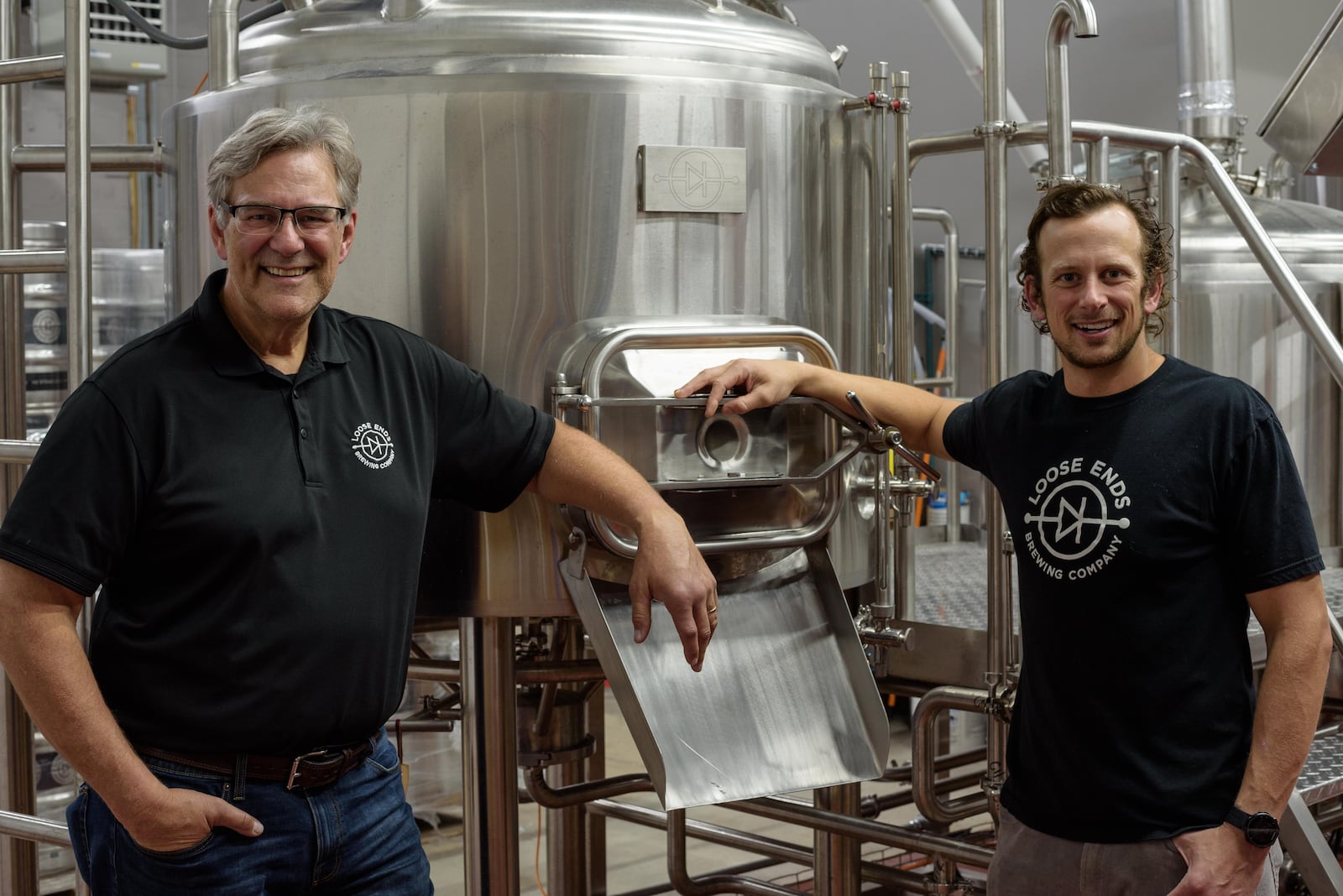 The soft opening of Loose Ends Brewing Company in Centerville was held October 1, 2020. Located at 890 S. Main St. (State Route 48) behind Kabuki in a strip retail center, the brewery will have its grand opening this Saturday, October 3rd. Pictured by the brewing tanks are John Loose and his father Kent Loose, the brewery's father/son ownership duo. TOM GILLIAM/CONTRIBUTING PHOTOGRAPHER