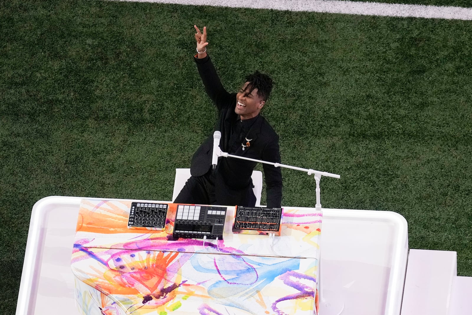 Jon Batiste performs the national anthem before the NFL Super Bowl 59 football game between the Kansas City Chiefs and the Philadelphia Eagles, Sunday, Feb. 9, 2025, in New Orleans. (AP Photo/David J. Phillip)