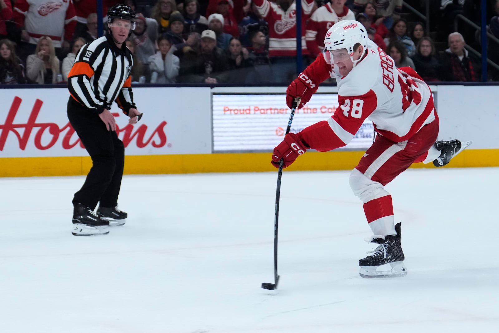 Detroit Red Wings right wing Jonatan Berggren (48) shoots on Columbus Blue Jackets goaltender Elvis Merzlikins (not in photo) and scores in the third period of an NHL hockey game in Columbus, Ohio, Thursday, Jan. 2, 2025. (AP Photo/Sue Ogrocki)