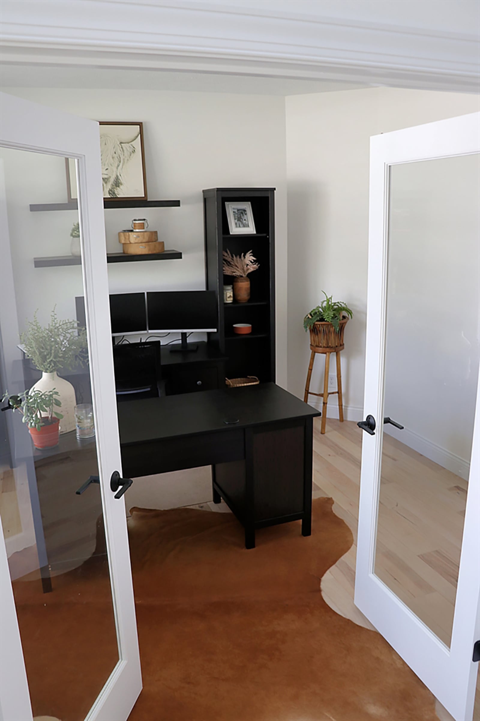 Double glass doors open into a study or office space with a front-facing window. CONTRIBUTED PHOTO BY KATHY TYLER