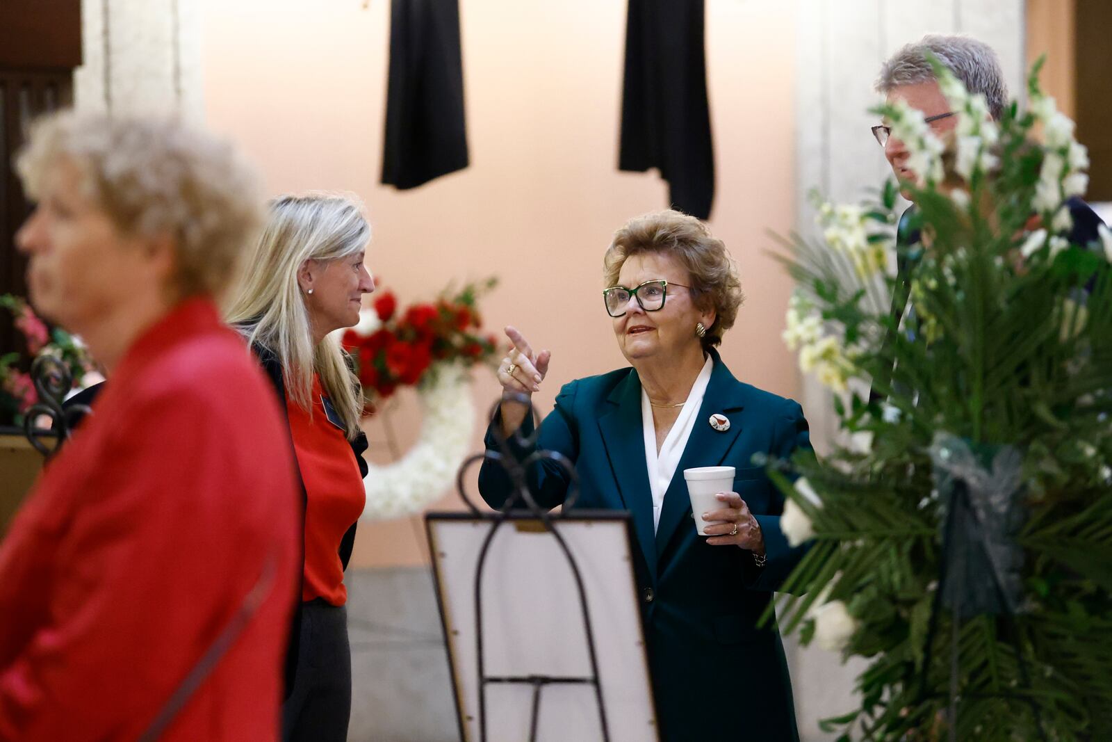 Former Ohio Attorney General Betty Montgomery talks to fellow mourners in the rotunda of the Ohio State House before the funeral for former Ohio House speaker Jo Ann Davidson in Columbus, Ohio, Thursday, Oct. 31, 2024. (AP Photo/Paul Vernon)