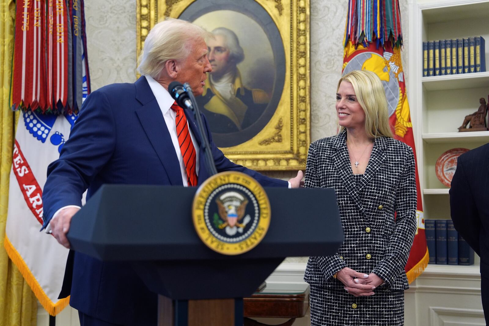 President Donald Trump welcomes Pam Bondi before she is sworn in as Attorney General by Supreme Court Associate Justice Clarence Thomas, in the Oval Office of the White House, Wednesday, Feb. 5, 2025, in Washington. (AP Photo/Evan Vucci)