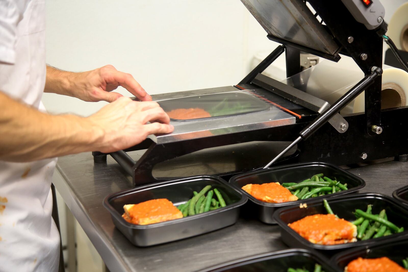 Prepared meals for clients of Pink Ribbon Girls are sealed and then frozen for delivery. LISA POWELL / STAFF