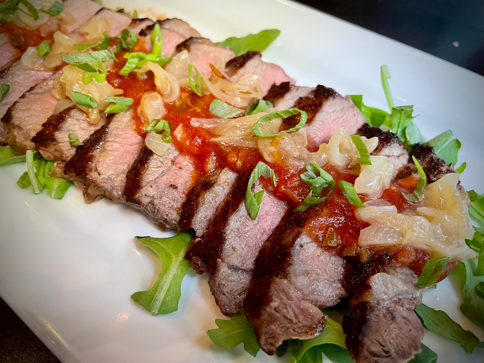 Roost Modern Italian in Dayton’s Oregon District has been rebranded as Culina, an Italian-inspired small plates restaurant and bar. Pictured is the New York Strip Tagliata. NATALIE JONES/STAFF