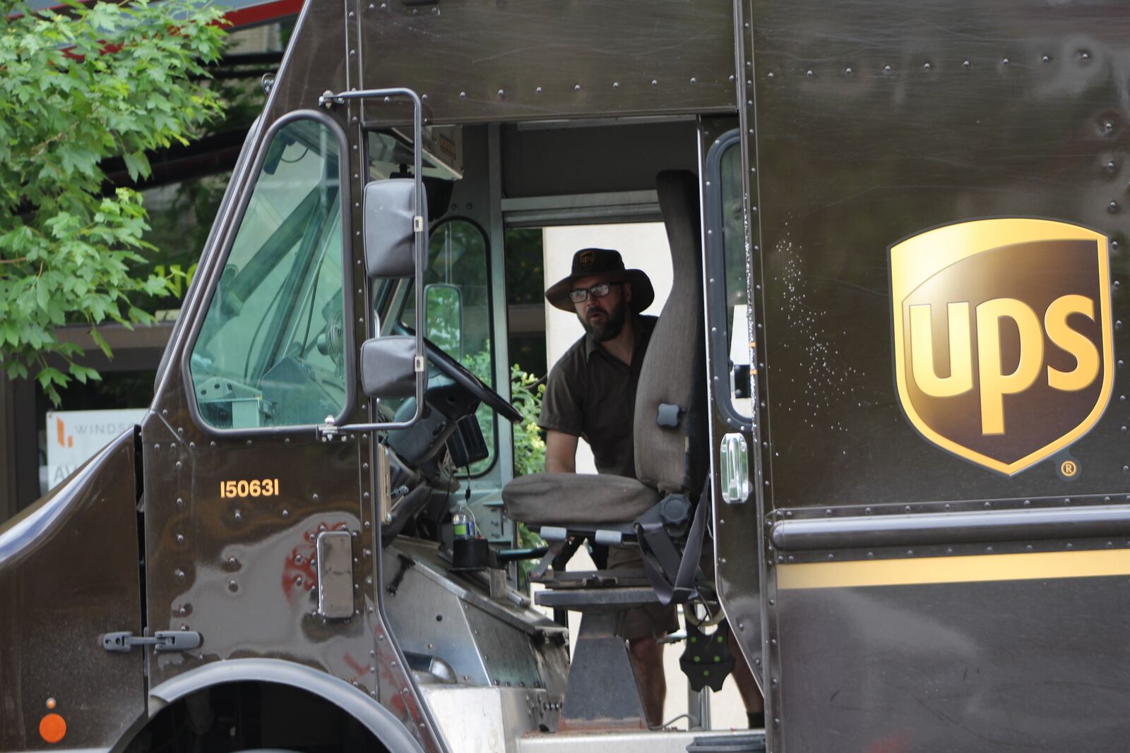 A UPS worker in downtown Dayton on Friday, May 27, 2022. CORNELIUS FROLIK / STAFF