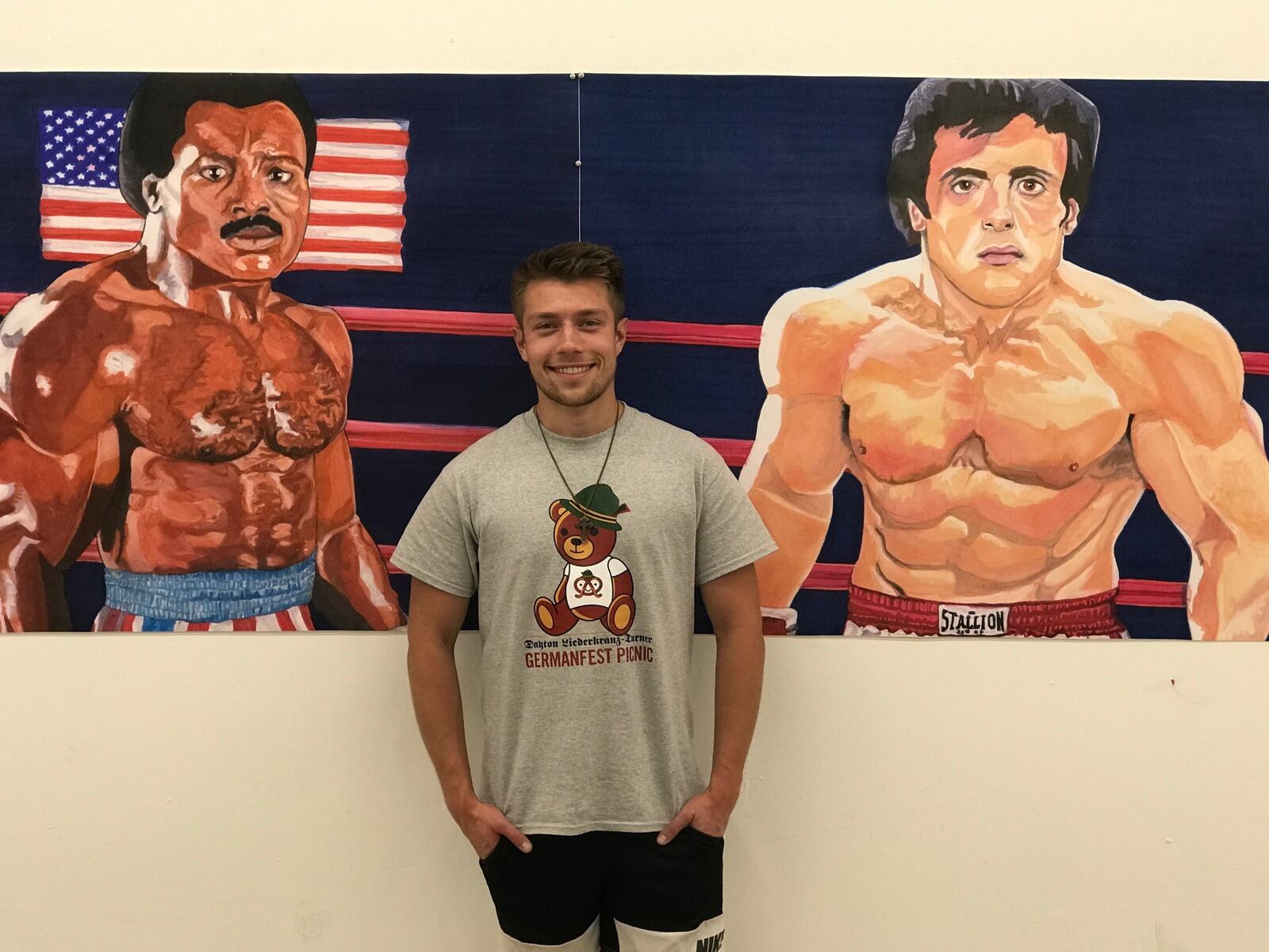 UD Student and Flyers boxer Jackson Stanard, the artist who drew the mural and did much of the work putting it on wall at Drakes. He’s a cruiserweight on the newly former UD boxing team. Tom Archdeacon/CONTRIBUTED