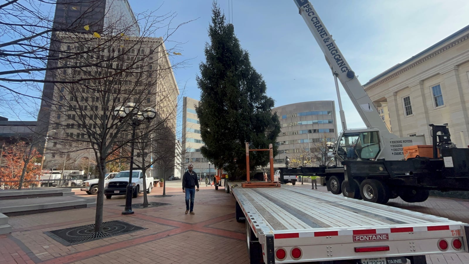 A 35-foot Christmas tree arrives at Courthouse Square in downtown Dayton on Wednesday, Nov. 8, 2023. The tree will be lit up on Nov. 24 as part of the Dayton Holiday Festival. CORNELIUS FROLIK / STAFF