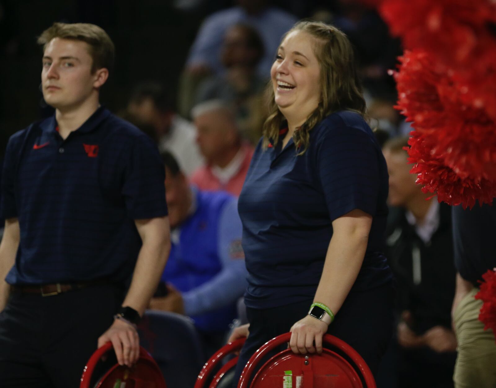 Dayton student manager Murphy Weiland smiles during a game against Richmond on Tuesday, March 1, 2022, at the Robins Center in Richmond, Va. David Jablonski/Staff