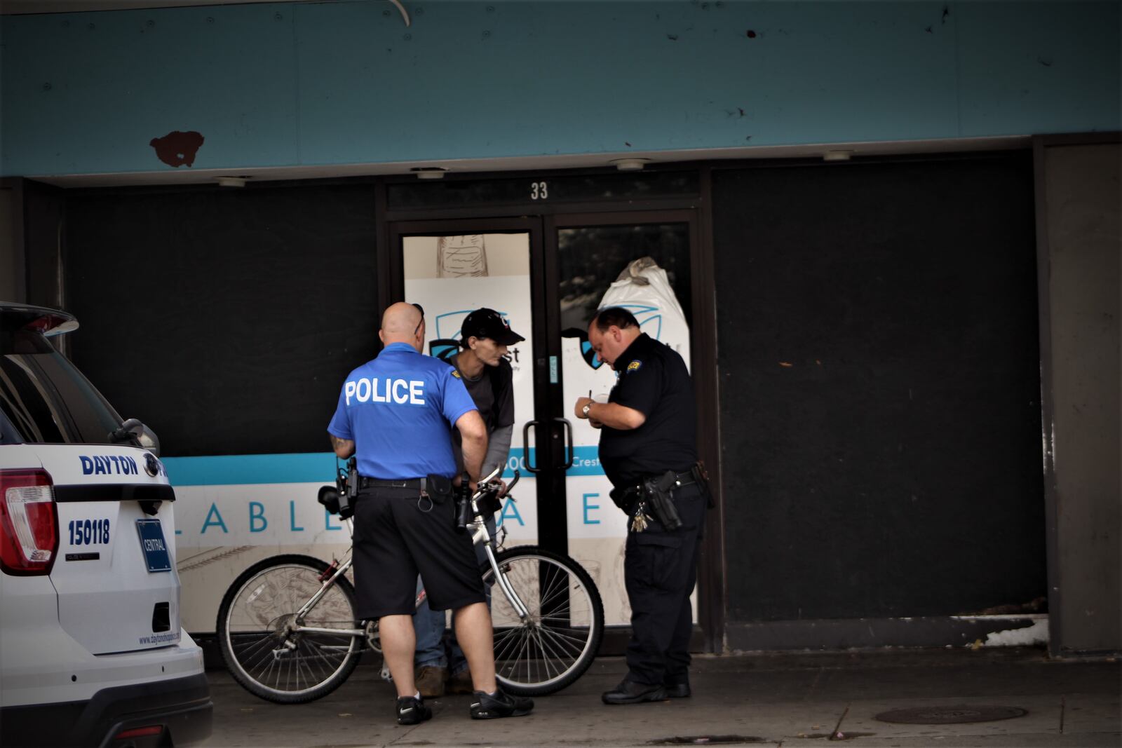 Dayton police officers interact with a citizen in downtown Dayton. CORNELIUS FROLIK / STAFF