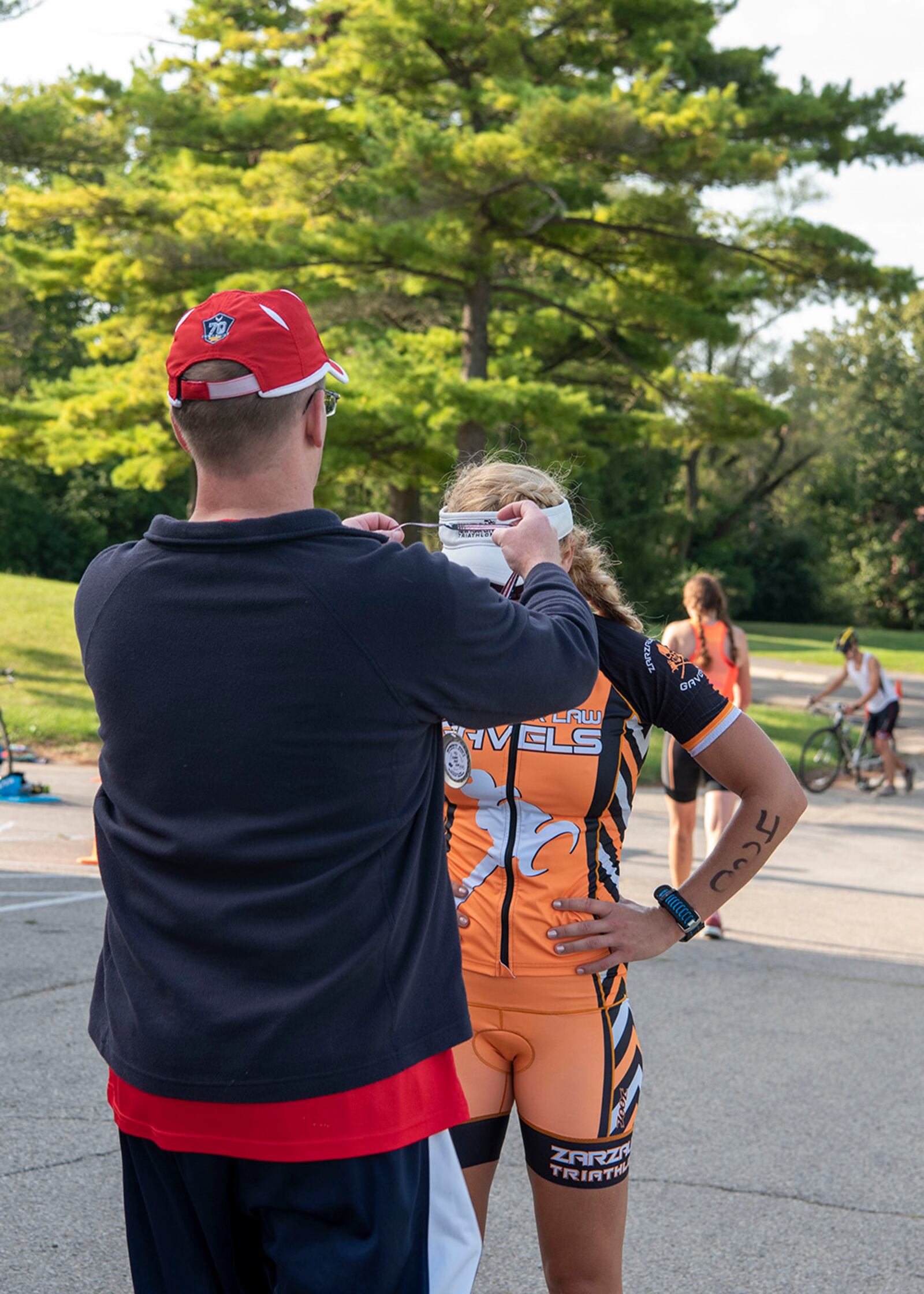 First Lt. Elizabeth Beaty, a flight nurse assigned to the 36th Aeromedical Evacuation Squadron at Keesler Air Force Base, Mississippi, is awarded a medal upon completing the sprint triathlon Sept. 11 at Wright-Patterson Air Force Base. Participants completed a 750-yard swim, 20K bike ride and 5K run. U.S. AIR FORCE PHOTO/STAFF SGT. MIKALEY KLINE