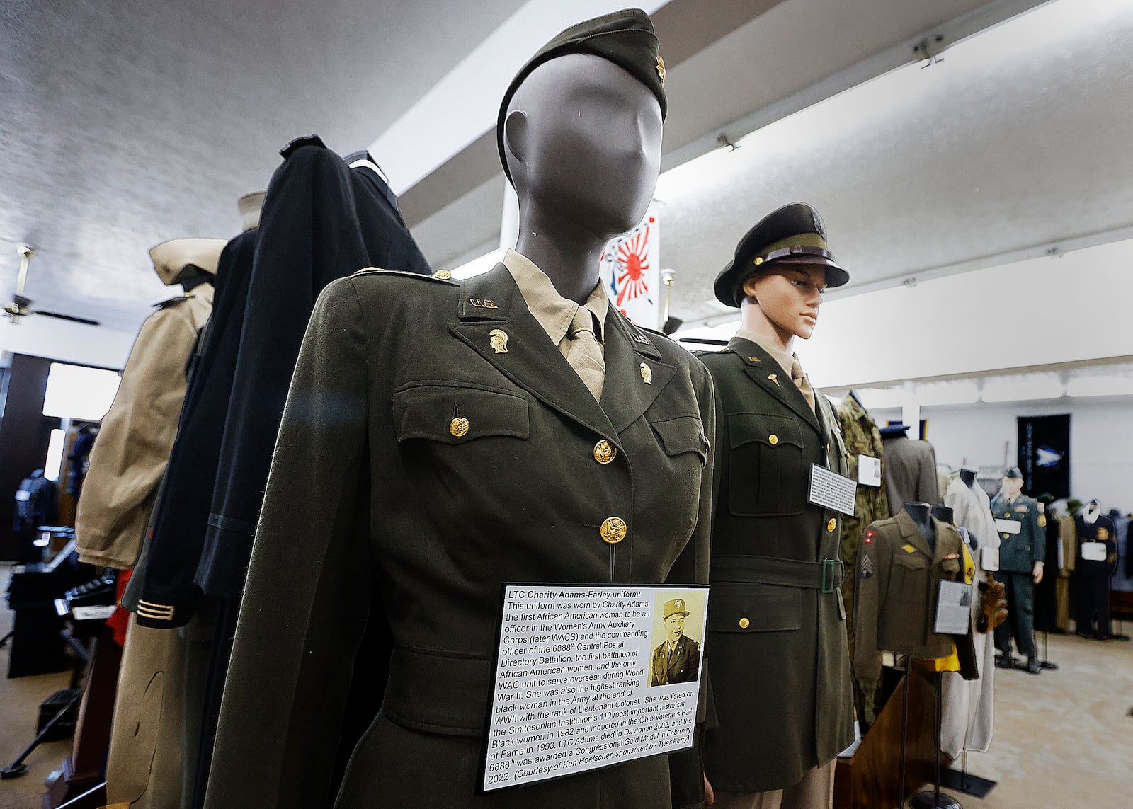 Several military uniforms are on display at the Miami Valley Military History Museum in Fairborn, including the uniform worn by Charity Adams Early who was from Dayton and recently the focus of the movie, the “Six Triple Eight.” The museum is planning a event to mark the 50th anniversary to mark the end of the Vietnam War. MARSHALL GORBY\STAFF