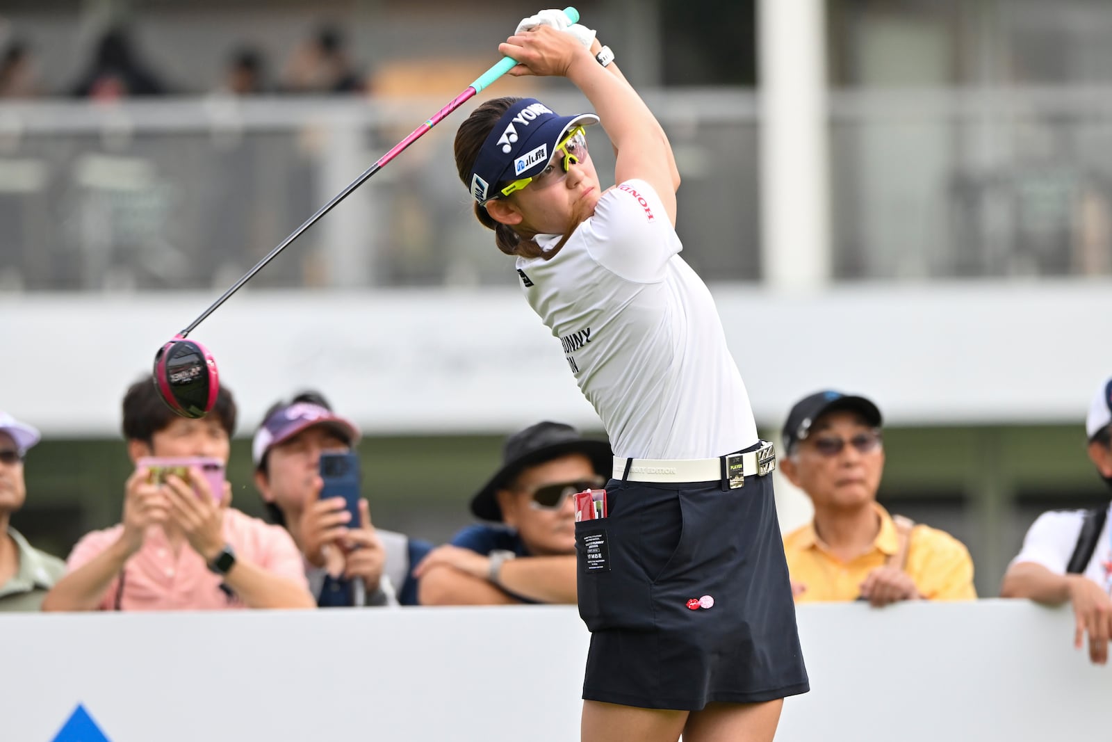 Chisato Iwai of Japan watches her shot on the 1st hole during the first round of the LPGA Honda Thailand golf tournament in Pattaya, southern Thailand, Thursday, Feb. 20, 2025. (AP Photo/Kittinun Rodsupan)