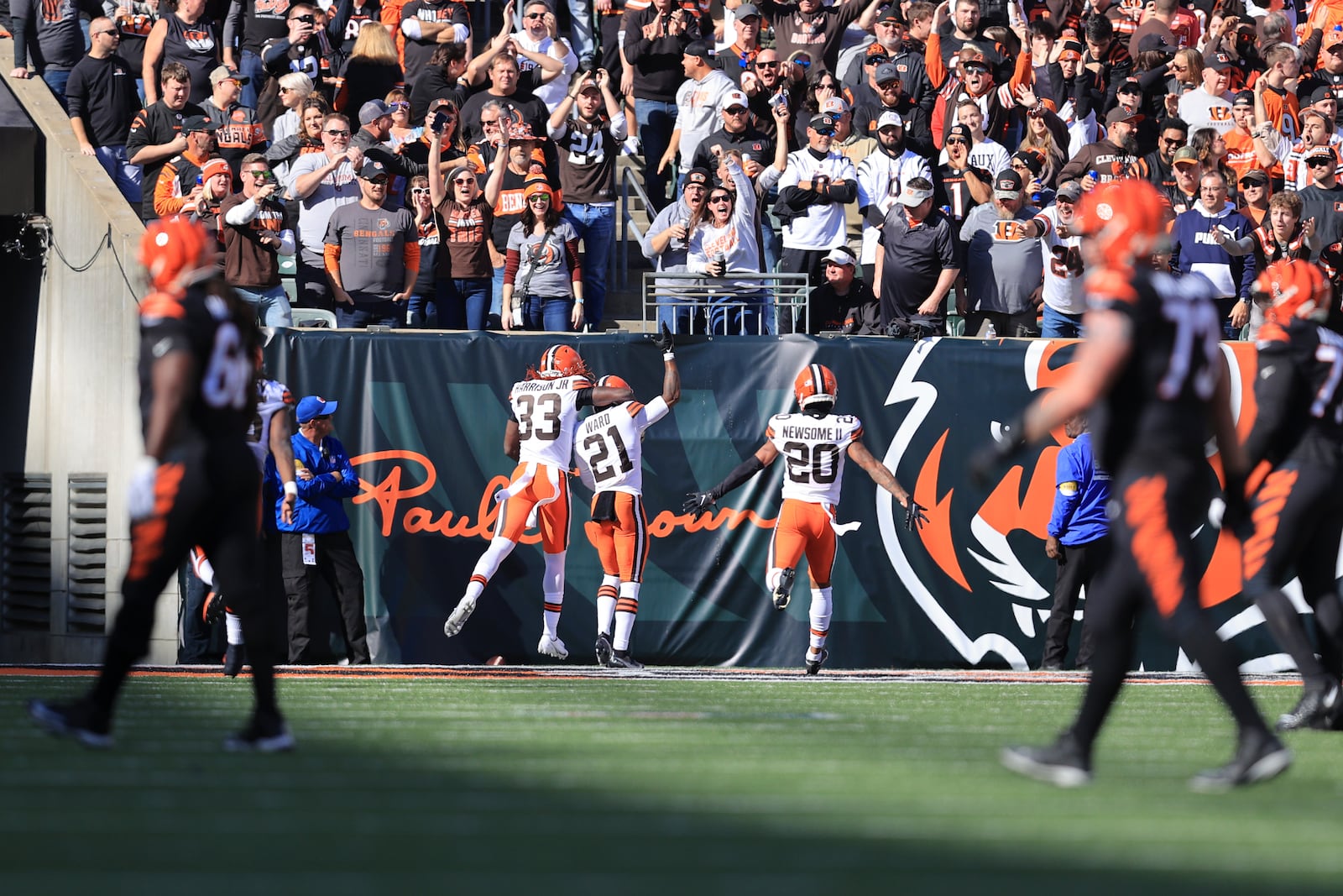 Cleveland Browns' Denzel Ward (21) celebrates after returning an interception for a touchdown during the first half of an NFL football game against the Cincinnati Bengals, Sunday, Nov. 7, 2021, in Cincinnati. (AP Photo/Aaron Doster)