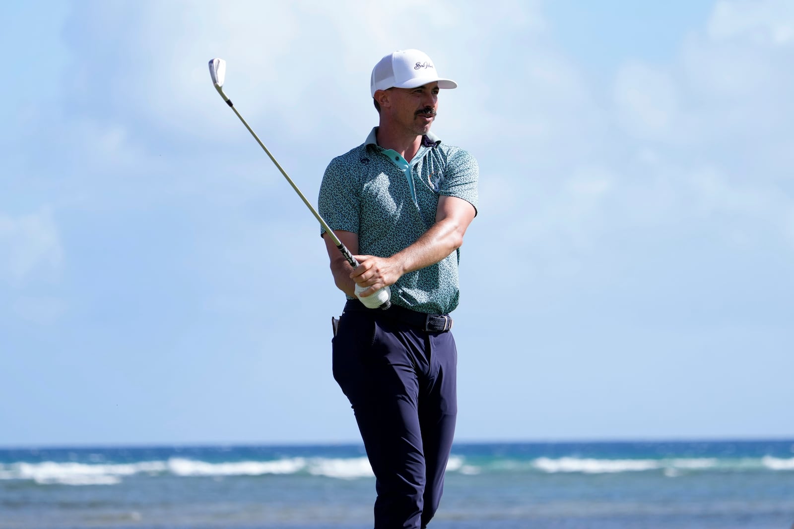 Paul Peterson hits a shot on the 17th hole during the third round of the Sony Open golf tournament, Saturday, Jan. 11, 2025, at Waialae Country Club in Honolulu. (AP Photo/Matt York)