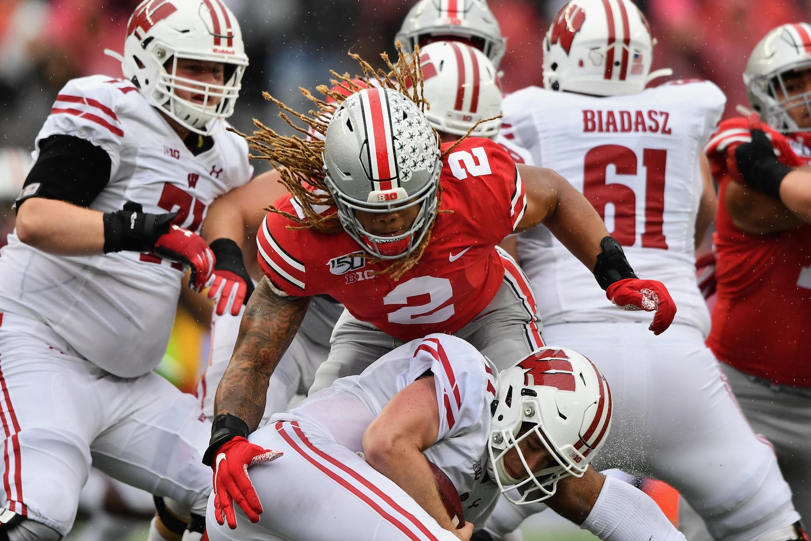 COLUMBUS, OH - OCTOBER 26: Quarterback Jack Coan #17 of the Wisconsin Badgers is sacked in the second quarter by Chase Young #2 of the Ohio State Buckeyes at Ohio Stadium on October 26, 2019 in Columbus, Ohio. (Photo by Jamie Sabau/Getty Images)