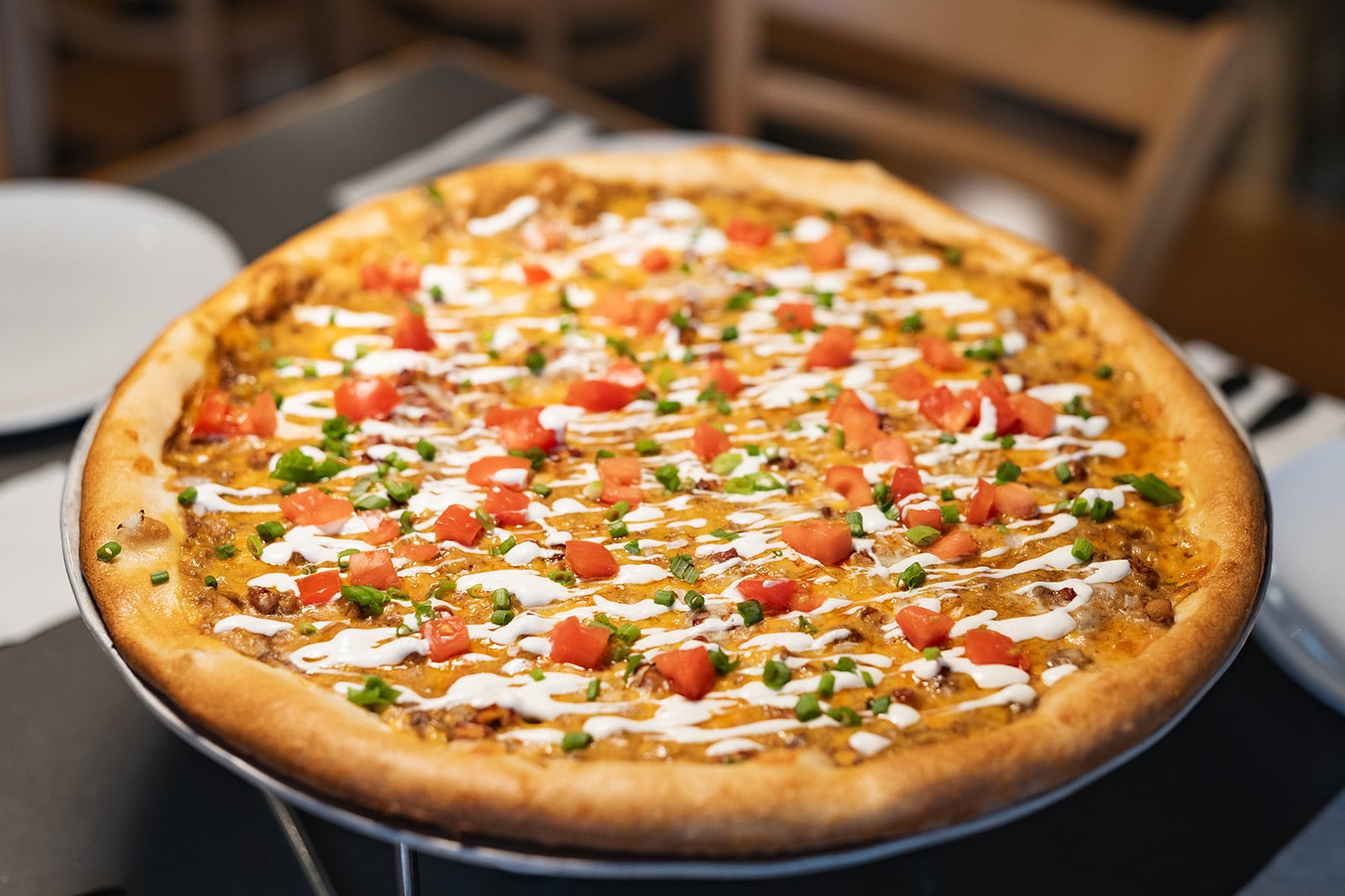 The Skyline Dip Deluxe pizza at Dewey's features a cream cheese base, topped with Skyline Chili, mozzarella and mild cheddar cheeses, red beans and onions. It’s then topped with sour cream, tomatoes and green onions (PHOTO COURTESY: THE MEISBERGERS).