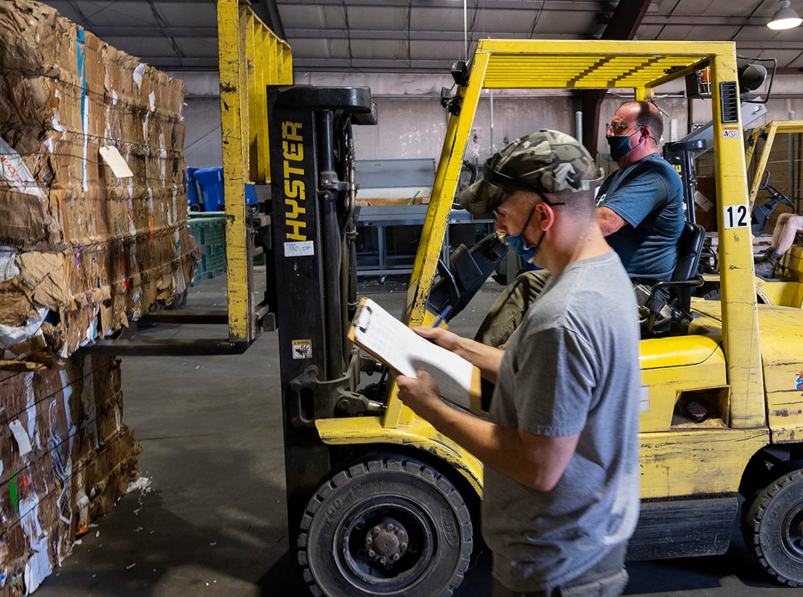 Dave Matheney keeps records as Robert White uses a forklift to pick up a cardboard bale Sept. 27 to be loaded onto a buyer’s truck at the Wright-Patterson Air Force Base Recycling Center. The 88th Force Support Squadron’s Recycling Center workers can load up to 44,000 pounds into a semitrailer. U.S. AIR FORCE PHOTO/R.J. ORIEZ