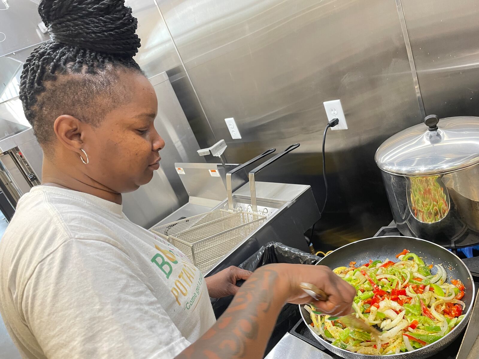 Dayton native Martina Scott, owner of Boss Potatoes, has quadrupled her customer base since she started cooking from her home almost four years ago. On Wednesday, Aug. 7 she started her first day as a member of 6888 Kitchen Incubator at the Dayton Arcade. NATALIE JONES/STAFF