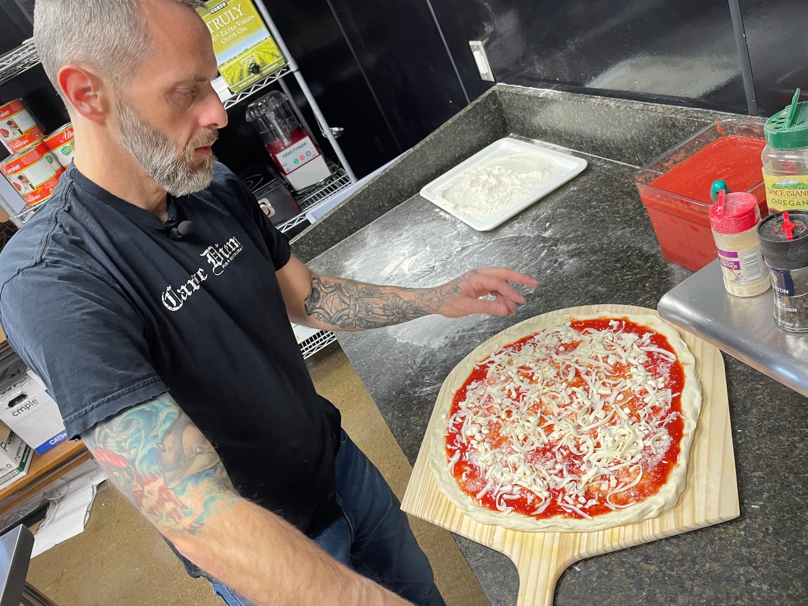 Red Bird Pizza, a new East Coast inspired pizzeria, is located at 18 N. Second St. in Miamisburg. Pictured is Christian Clothier, who owns the pizza shop with his neighbor, Ife Olaore. NATALIE JONES/STAFF