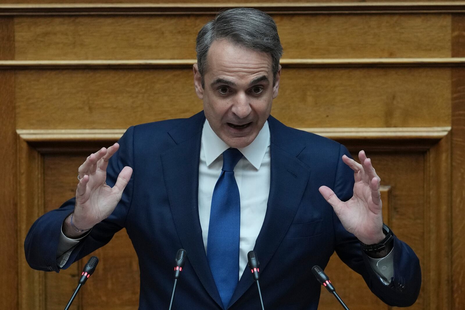 Greek Prime Minister Kyriakos Mitsotakis speaks in parliament ahead of the submission of a no-confidence motion by opposition parties over the government's handling of Greece's worst rail disaster two year ago, in Athens, Wednesday, March 5, 2025. (AP Photo/Thanassis Stavrakis)