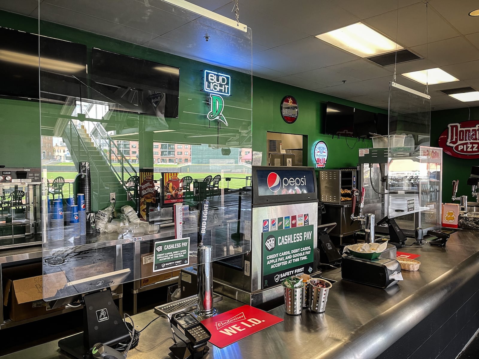 Plexiglass dividers are set-up at the concession stand at Day Air Ballpark. JIM NOELKER/STAFF