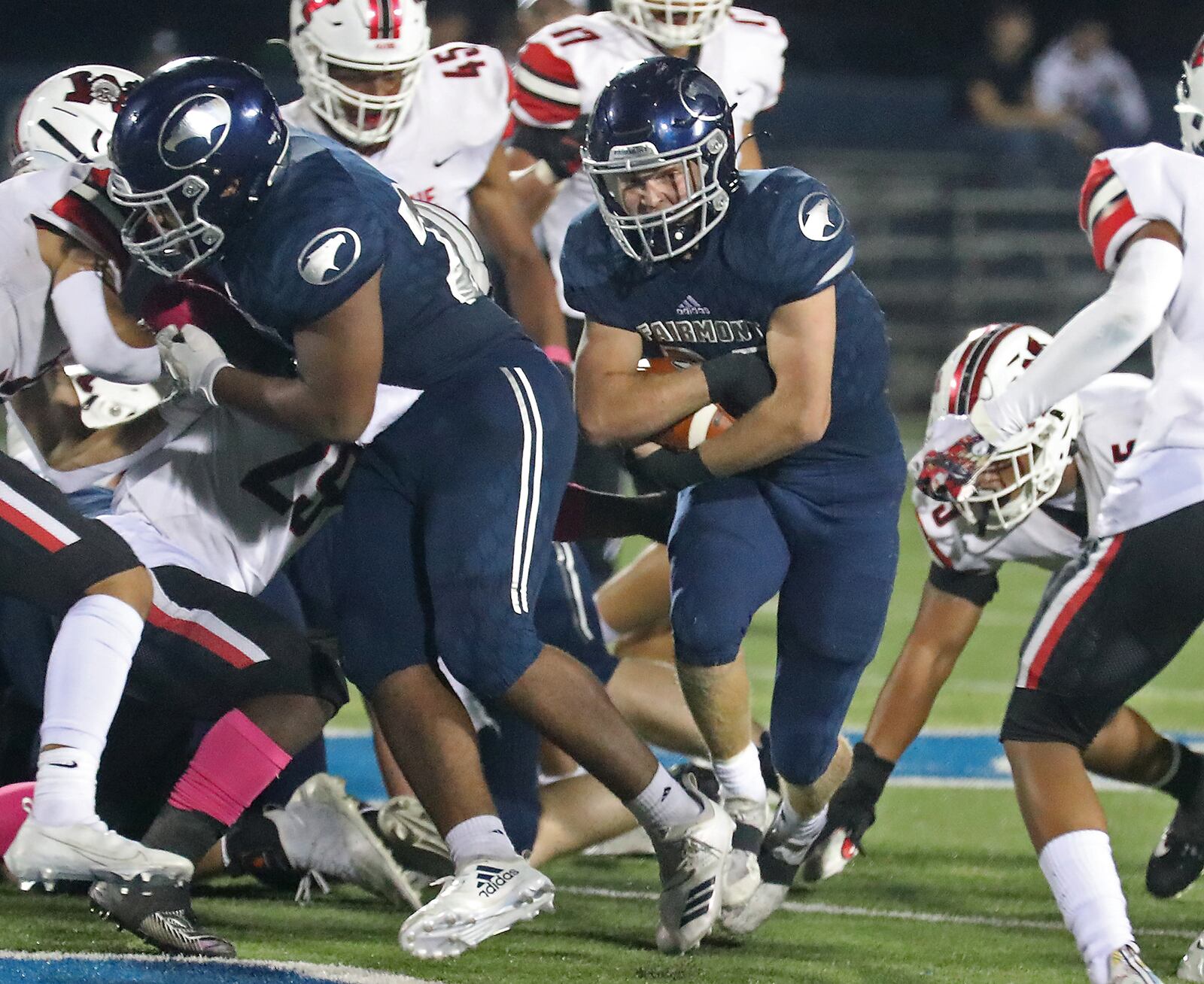 Fairmont's Drew Baker rushes for a first down against Wayne. BILL LACKEY/STAFF