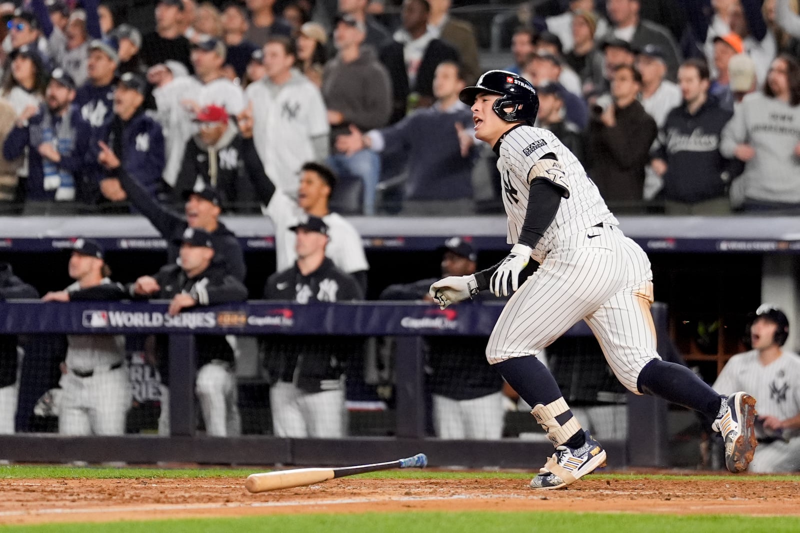 New York Yankees' Anthony Volpe celebrates his grand slam home run against the Los Angeles Dodgers during the third inning in Game 4 of the baseball World Series, Tuesday, Oct. 29, 2024, in New York. (AP Photo/Ashley Landis)