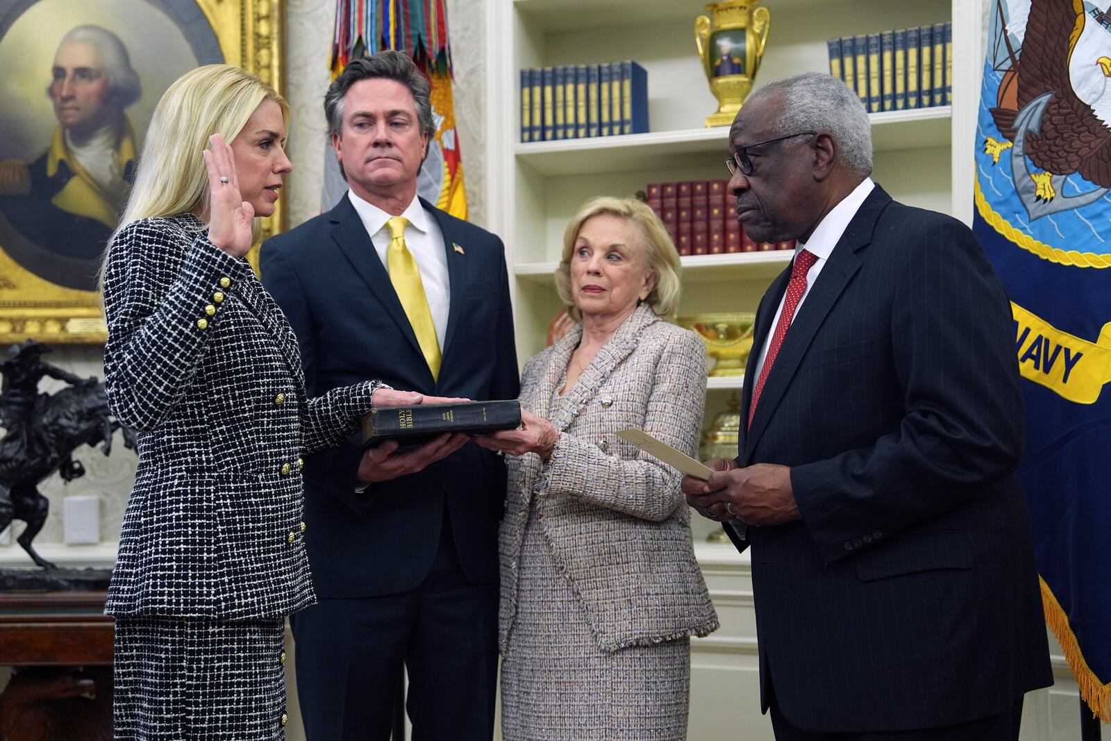 Pam Bondi is sworn in as Attorney General by Supreme Court Associate Justice Clarence Thomas, right, as President Donald Trump and John Wakefield and Patsy Bondi, look on, in the Oval Office of the White House, Wednesday, Feb. 5, 2025, in Washington. (AP Photo/Evan Vucci)