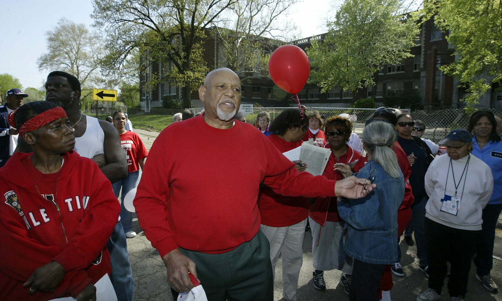 Thomas Webb, who was principal when Roosevelt High School closed in 1975 talks, to former students spanning the years at a farewell remembrance at the school before demolition in 2008. Staff photo by Chris Stewart