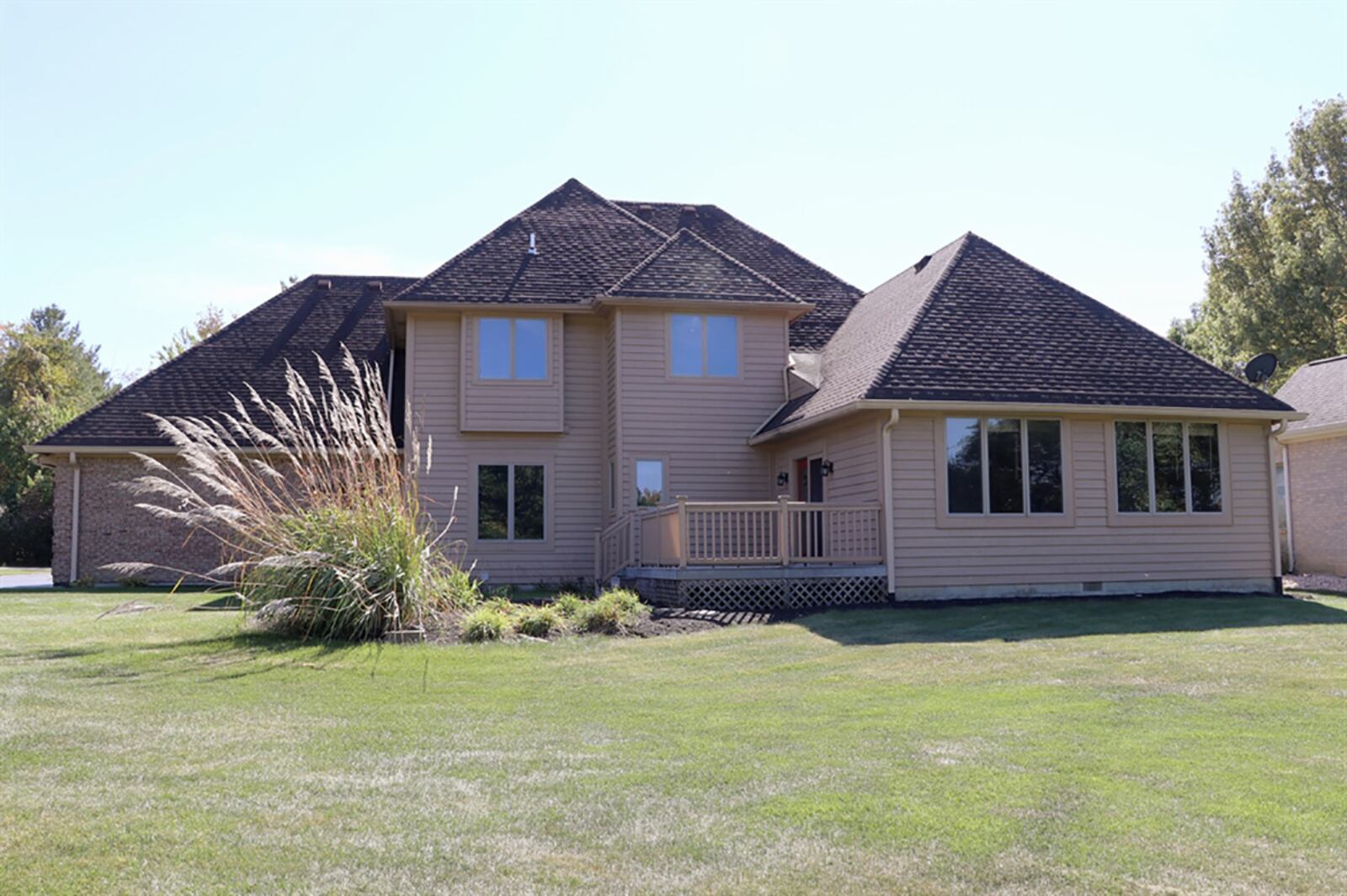 An addition off the back of the house provides for a family room or recreation room. Nine windows provide panoramic views of the back yard, and oversized glass patio doors open to a composite deck with railing. CONTRIBUTED PHOTO BY KATHY TYLER