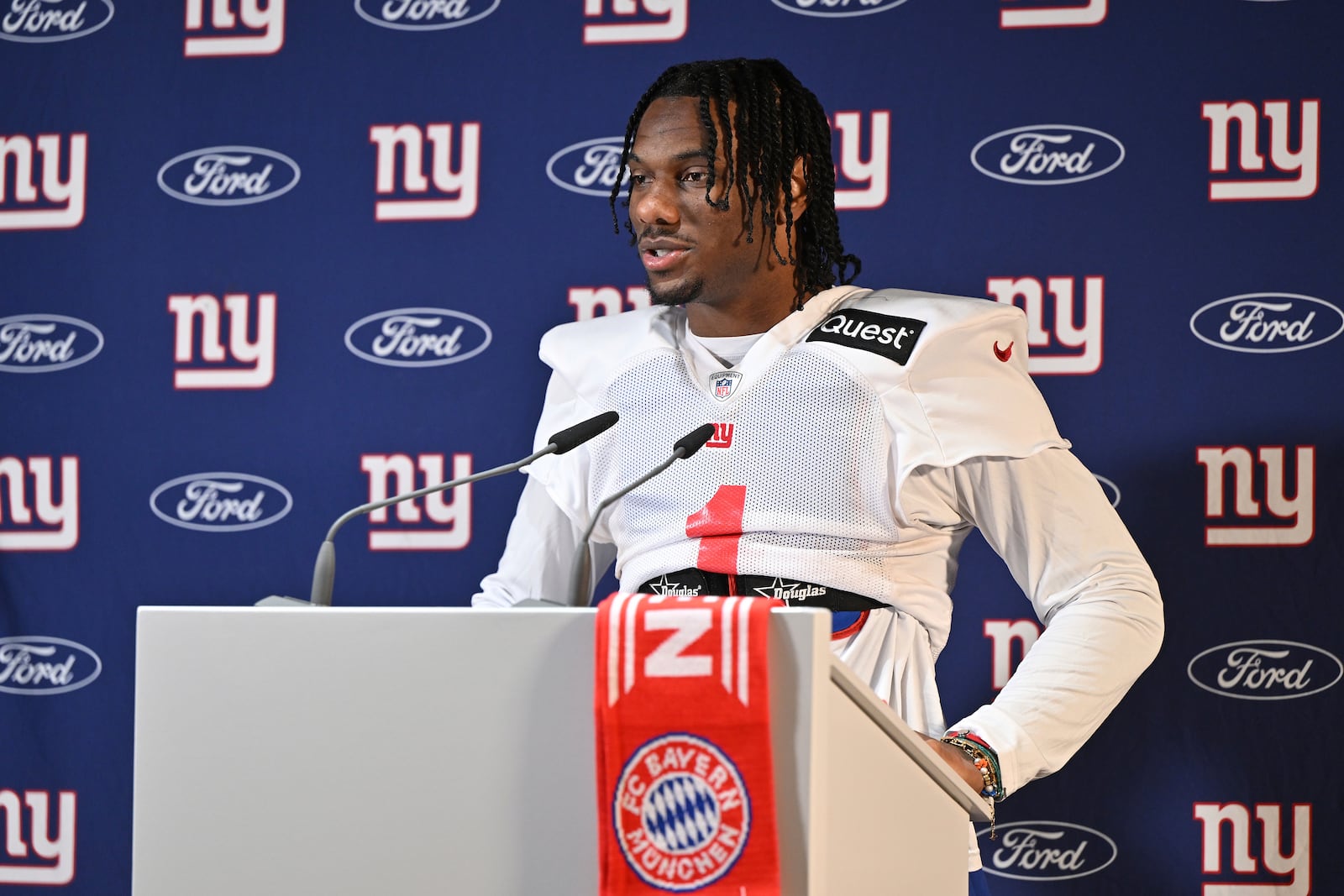 New York Giants wide receiver Malik Nabers (1) attends a news conference after a practice session in Munich, Germany, Friday, Nov. 8, 2024. The New York Giants are set to play the Carolina Panthers in an NFL game at the Allianz Arena in Munich on Sunday. (AP Photo/Lennart Preiss)