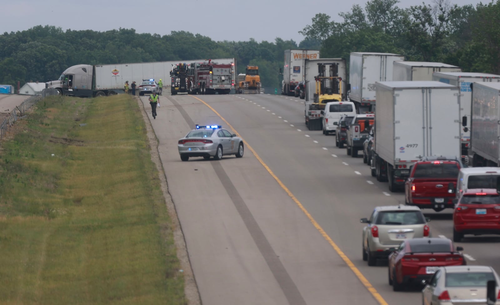 Traffic was backed up for miles on eastbound Interstate 70 after a crash between a semi truck and several cars east of Ohio Route 54 in Clark County on Monday, June 12, 2023. BILL LACKEY/STAFF