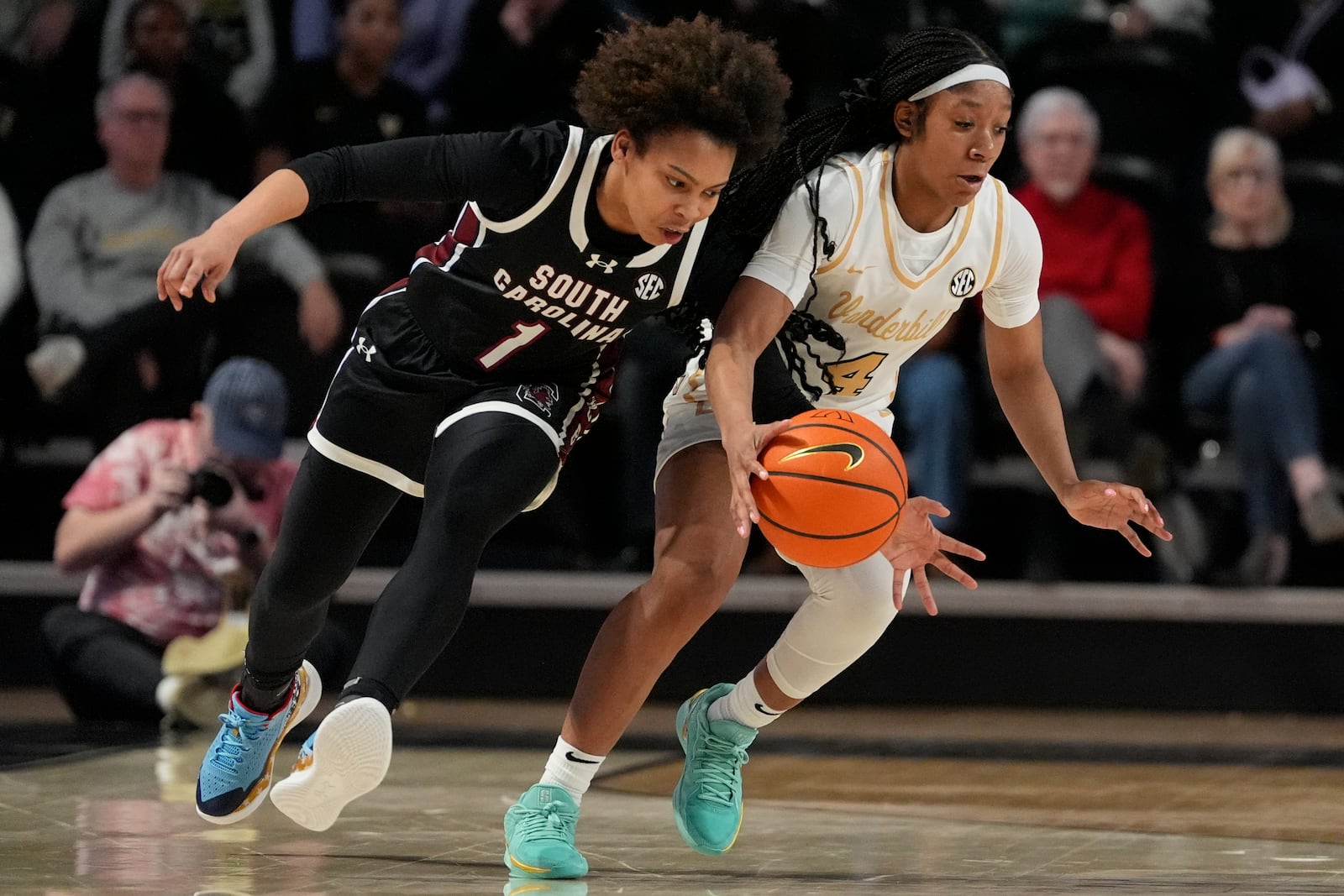 Vanderbilt guard Madison Greene (4) steals the ball from South Carolina guard Maddy McDaniel (1) during the second half of an NCAA college basketball game Sunday, Feb. 23, 2025, in Nashville, Tenn. (AP Photo/George Walker IV)