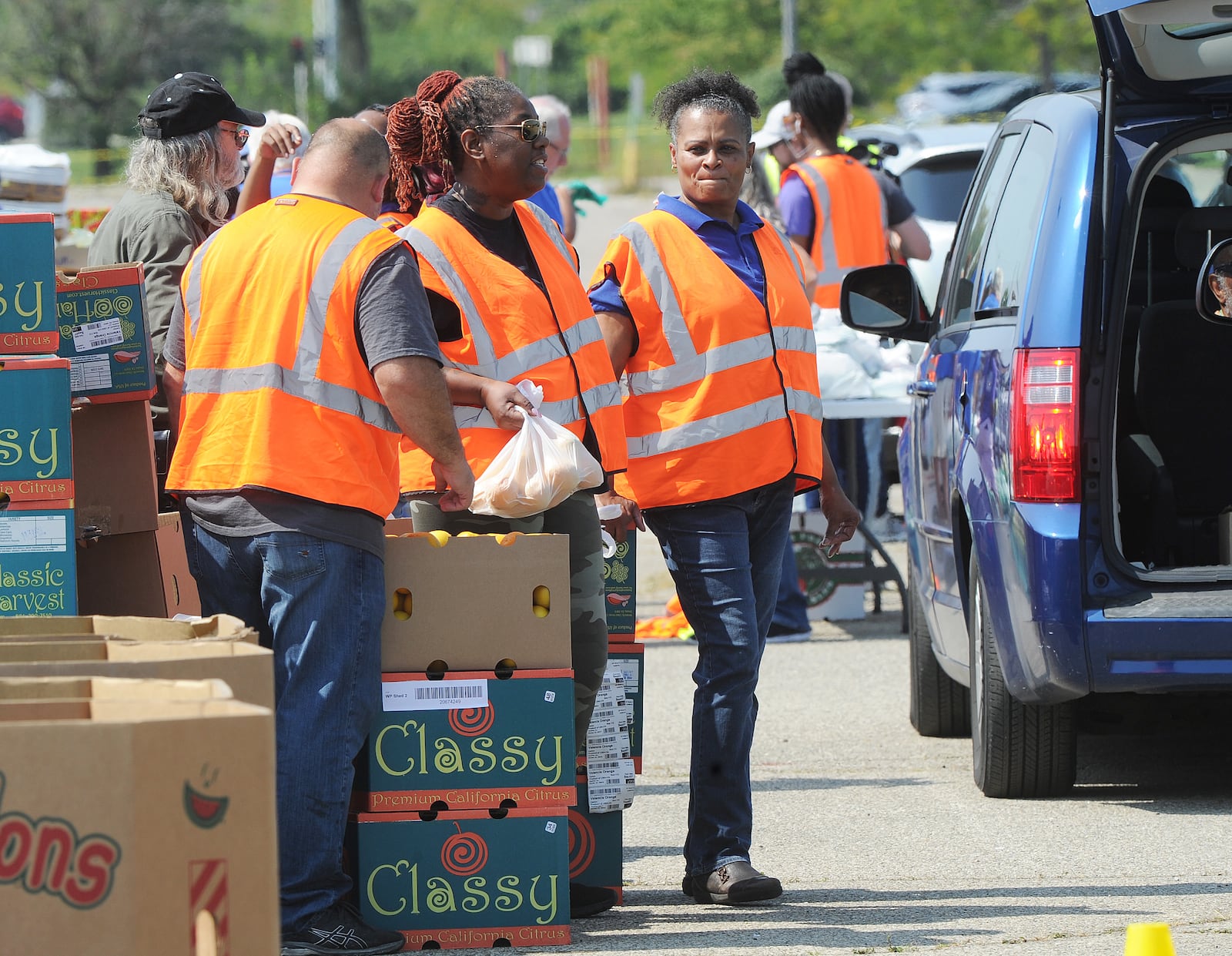 The Foodbank Inc. held a drive-thru food distribution at the old Salem Mall in Trotwood Thursday Sept. 15, 2022. Guests received fresh produce, proteins, grains and other products free of charge. MARSHALL GORBY\STAFF