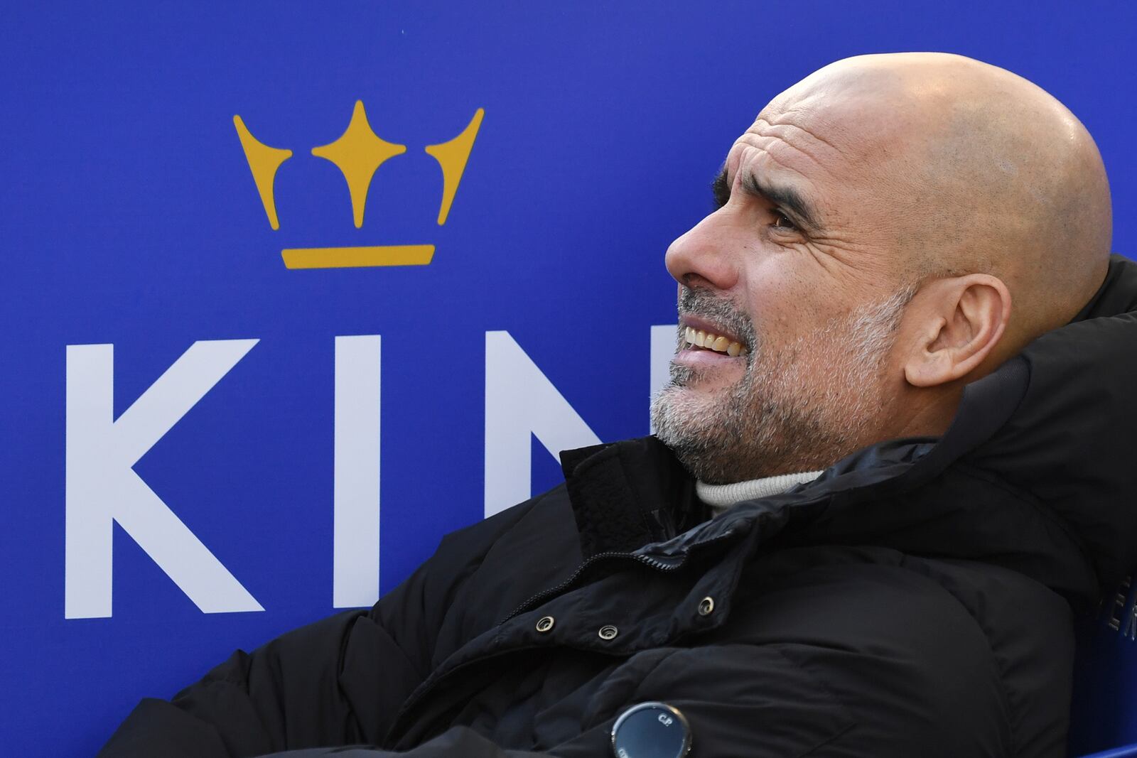 Manchester City's head coach Pep Guardiola looks out from the bench prior the English Premier League soccer match between Leicester City and Manchester City at King Power stadium in Leicester, England, Sunday, Dec. 29, 2024. (AP Photo/Rui Vieira)