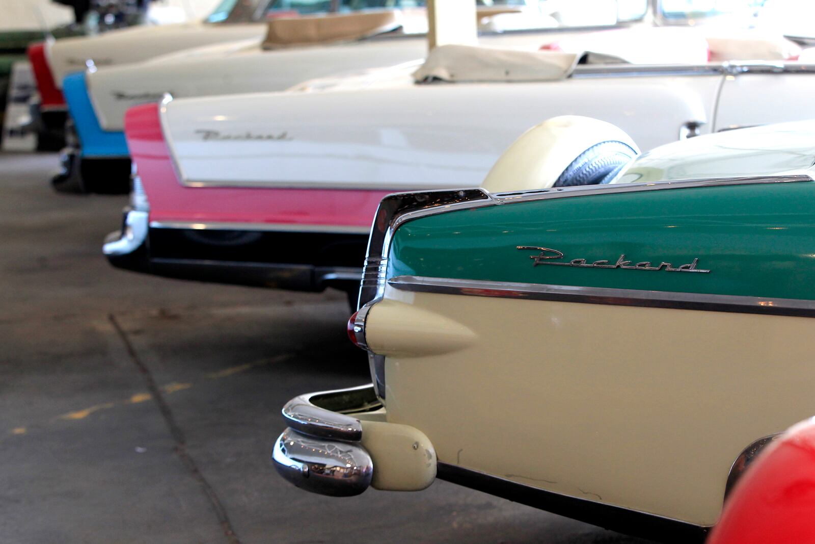 The Packard Caribbean built in the 1950s with details in blue, pink, red and green on display at America’s Packard Museum, the world’s only restored Packard dealership operating as a museum. LISA POWELL / STAFF