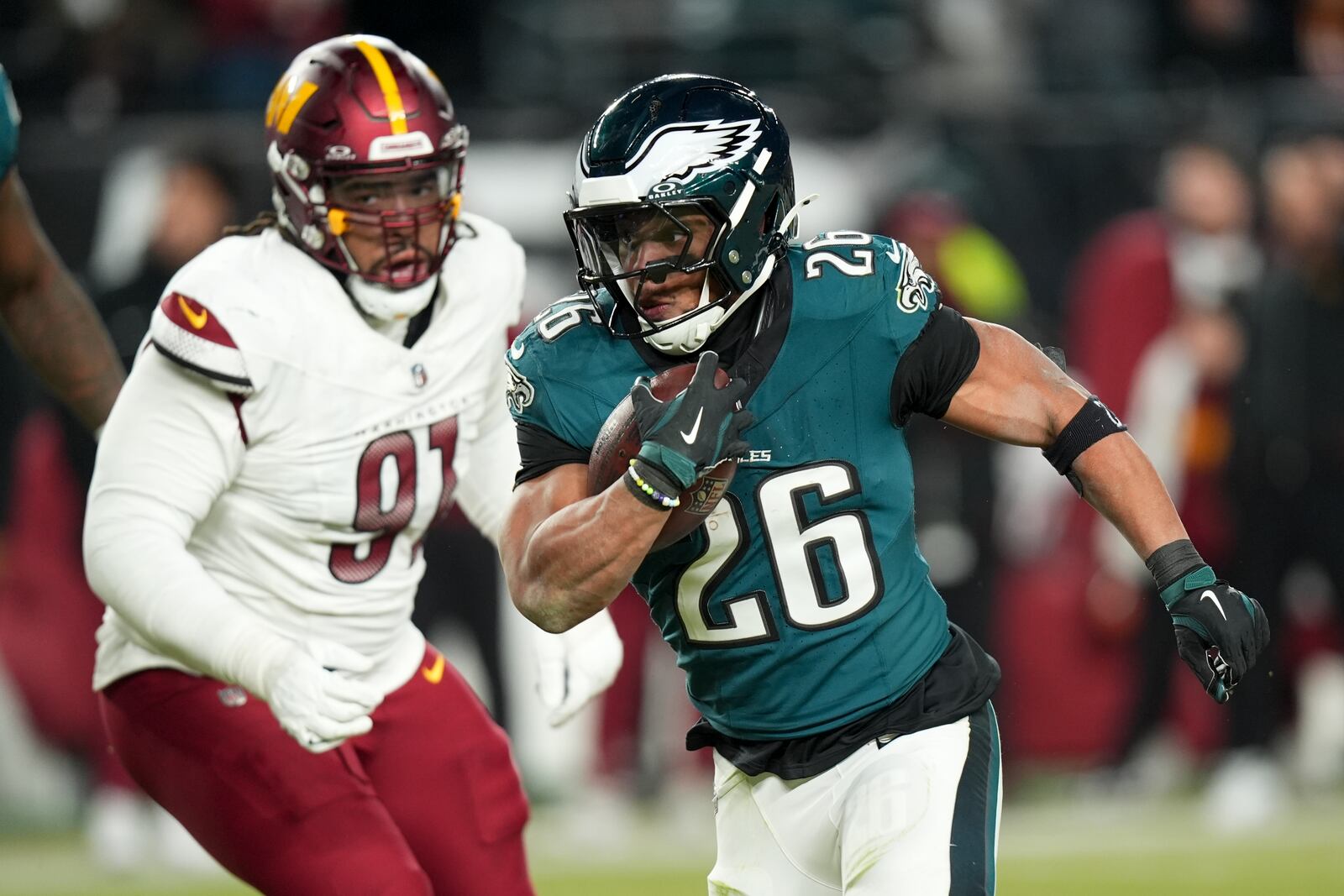 Philadelphia Eagles running back Saquon Barkley runs against the Washington Commanders during the second half of the NFC Championship NFL football game, Sunday, Jan. 26, 2025, in Philadelphia. (AP Photo/Chris Szagola)