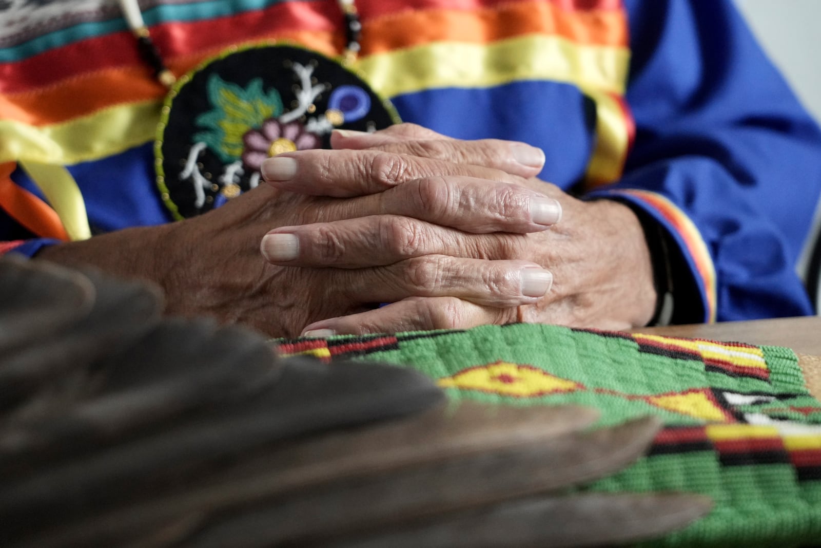 Leonard Peltier clasps his hands during an interview in Belcourt, N.D, on Tuesday, Feb. 25, 2025. (AP Photo/Mark Vancleave)