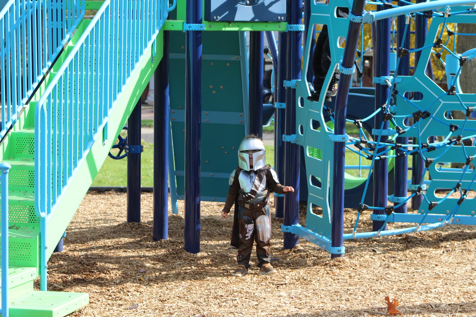 Hudson Edwards, 4, enjoys the new playground at Ridgecrest Park on Sunday. He dressed as the Mandalorian for Halloween. CORNELIUS FROLIK / STAFF