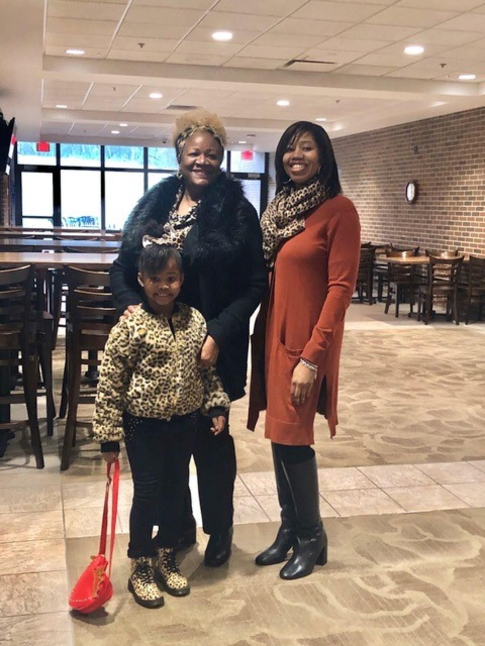 Three generations of women are self-quarantined at the home of Margaret Booze. Here, she is pictured with her daughter, KenEsha, and her granddaughter, Joi Ava. CONTRIBUTED